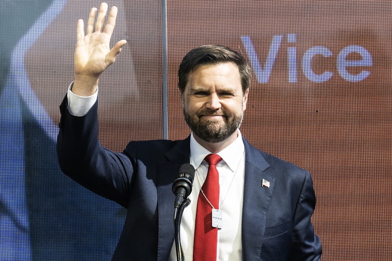 JD Vance smiles and waves at an October 7 memorial event