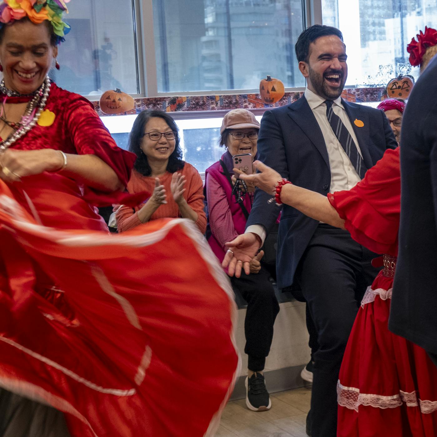 Mamdani dancing with seniors at a the Essex Cross Community Center in Lower Manhattan 
