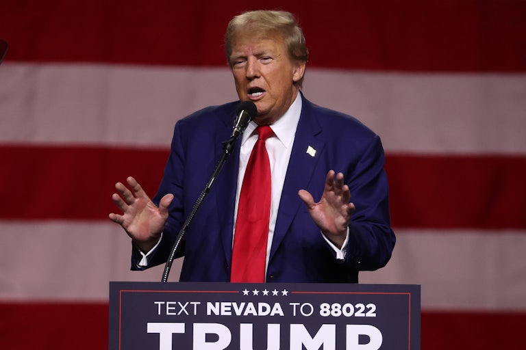 Trump speaks at a podium.