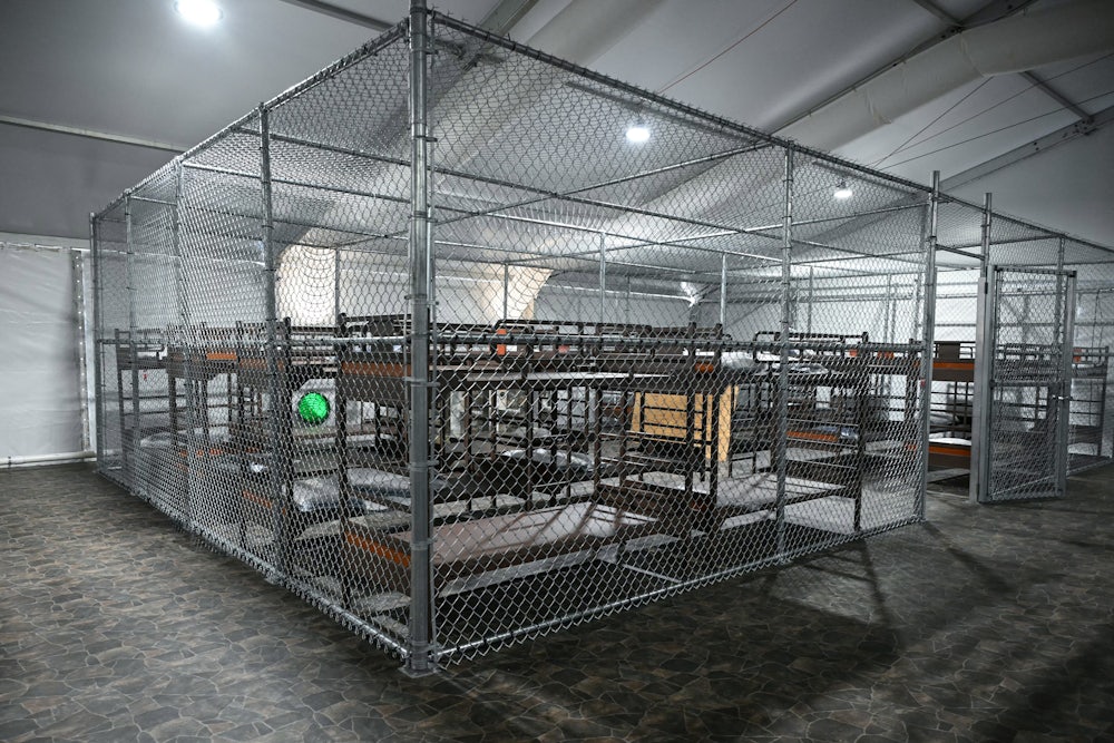 Cages with bunkbeds inside the Alligator Alcatraz facility in Florida.