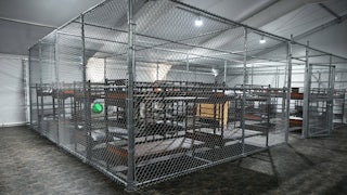 Cages with bunkbeds inside the Alligator Alcatraz facility in Florida.