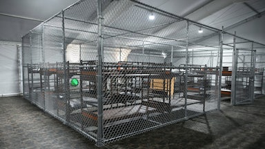Cages with bunkbeds inside the Alligator Alcatraz facility in Florida.