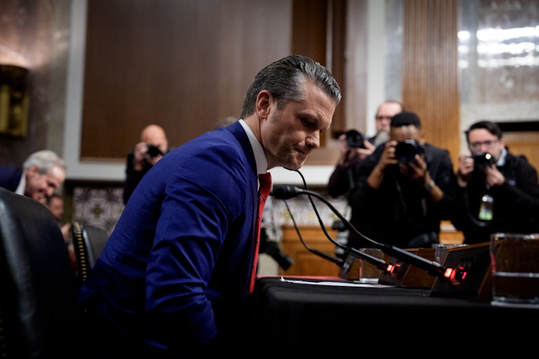Pete Hegseth looks down during his Senate confirmation hearing