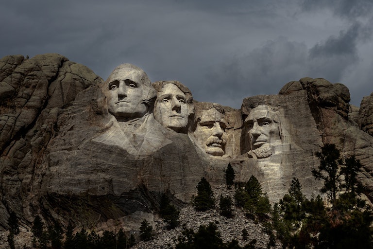 A picture of Mount Rushmore with the faces illuminated.