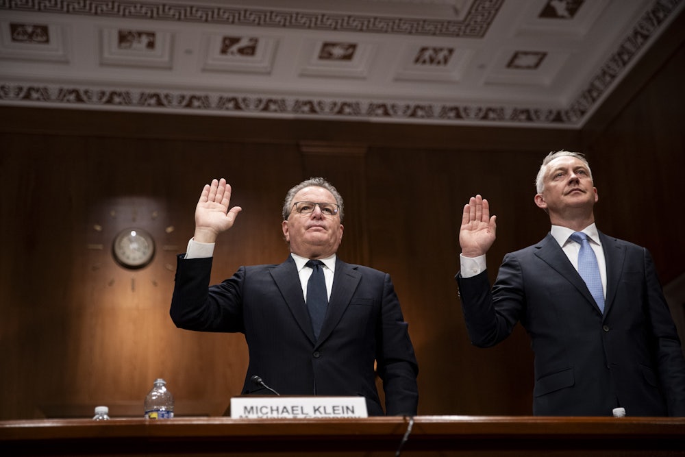 Executives at top American consulting firms are sworn-in during a Senate subcommittee hearing in Washington, DC.
