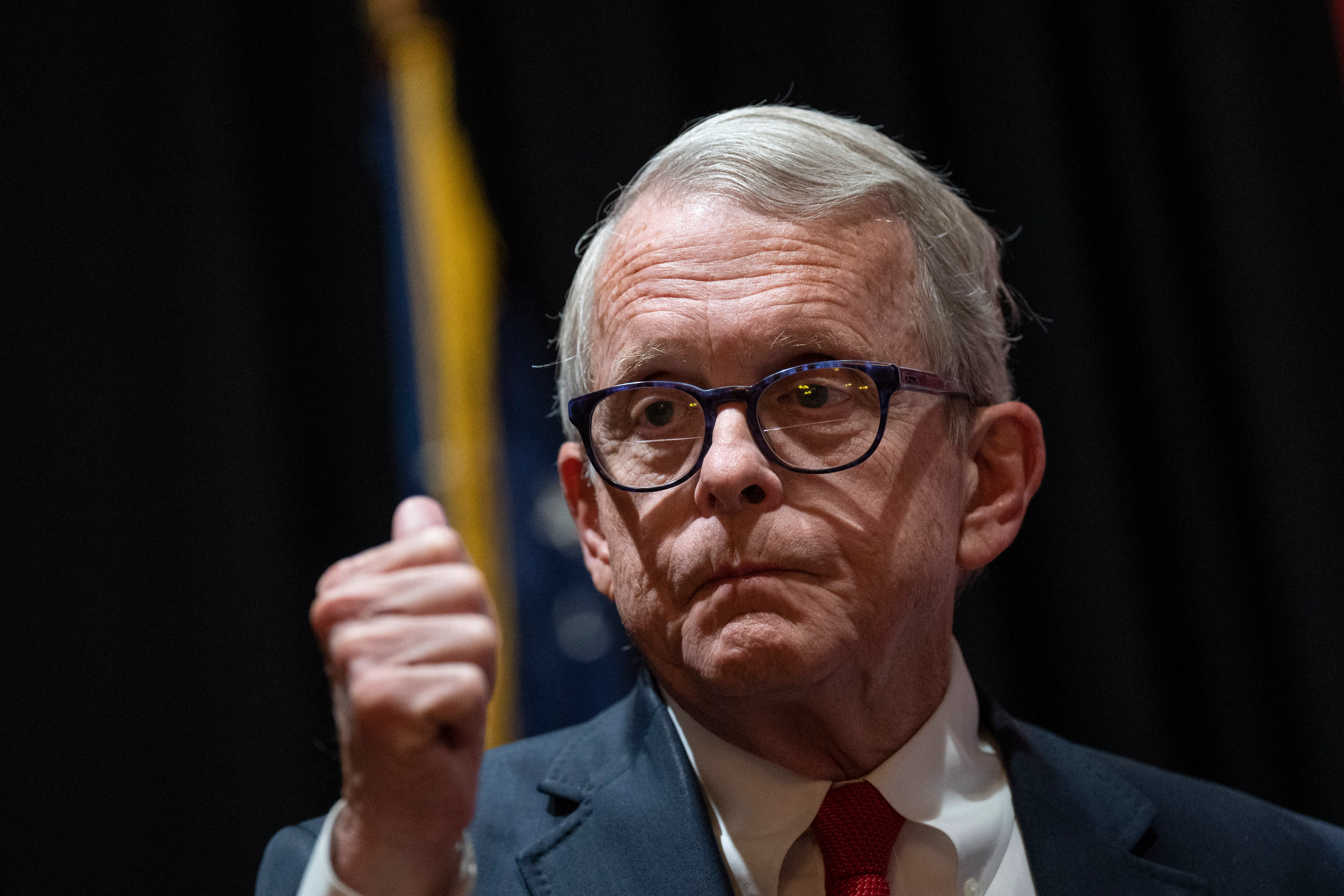 Ohio Governor Mike DeWine makes a fist as if emphasizing a point.
