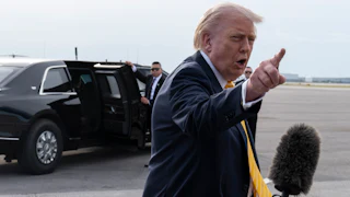 Donald Trump points and yells at a reporter (not pictured)