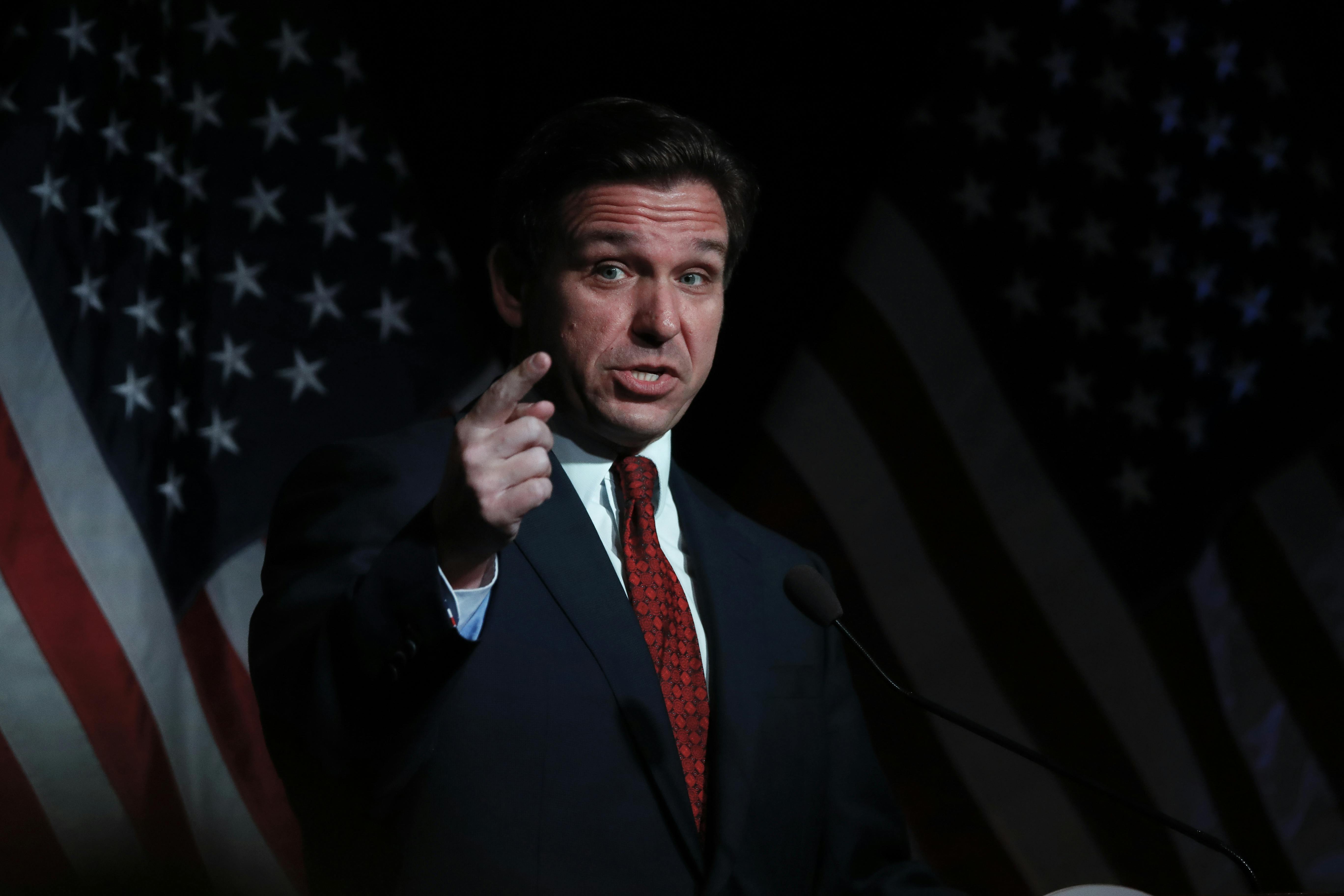 Ron DeSantis points while speaking.