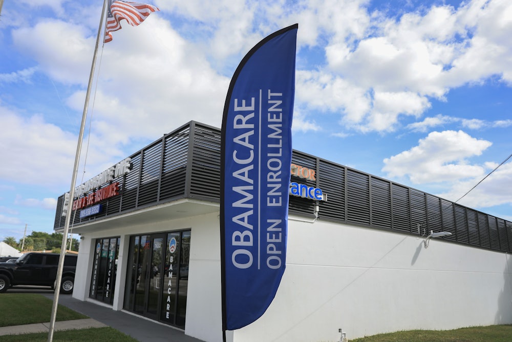 An Obamacare sign sits in front of an insurance agency on November 12, 2025 in Miami, Florida.