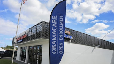 An Obamacare sign sits in front of an insurance agency on November 12, 2025 in Miami, Florida.