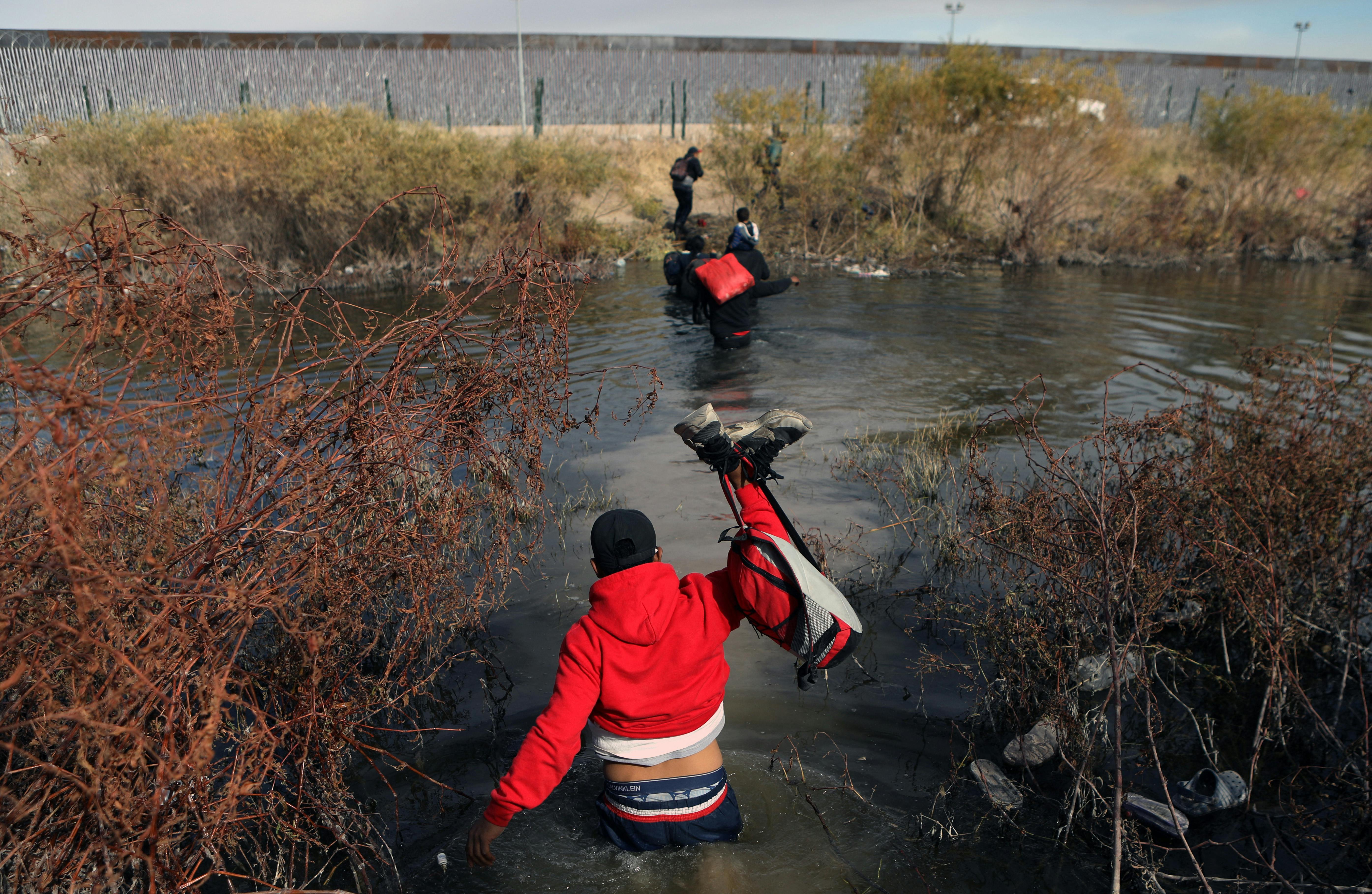Migrants cross the Rio Grande river into the U.S. through Ciudad Juarez, Mexico.