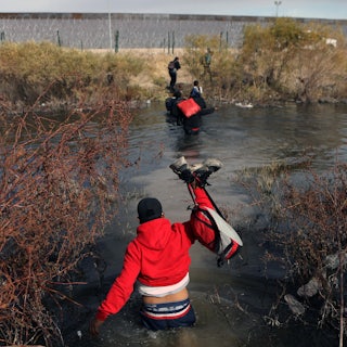 Migrants cross the Rio Grande river into the U.S. through Ciudad Juarez, Mexico.