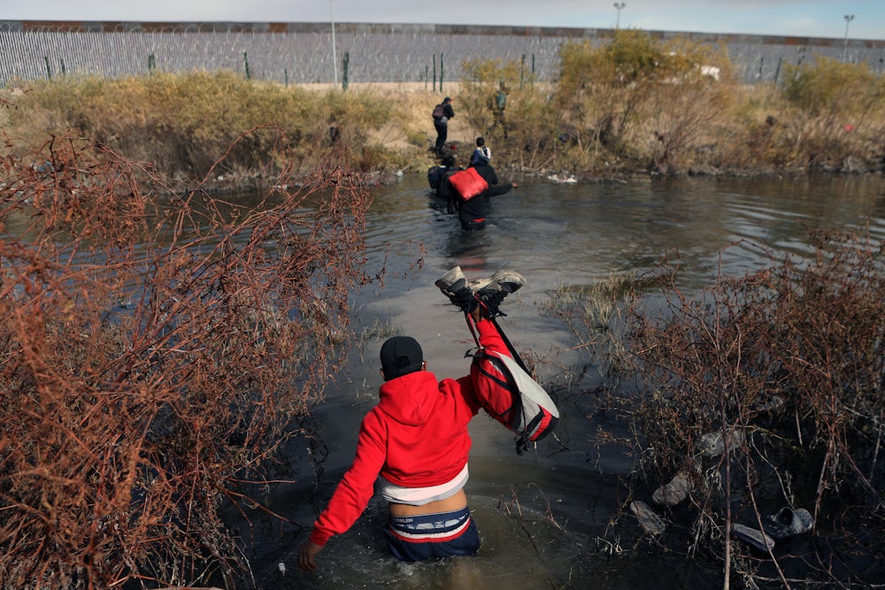 Migrants cross the Rio Grande river into the U.S. through Ciudad Juarez, Mexico.