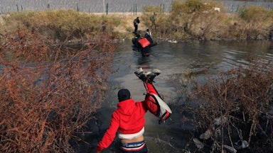 Migrants cross the Rio Grande river into the U.S. through Ciudad Juarez, Mexico.