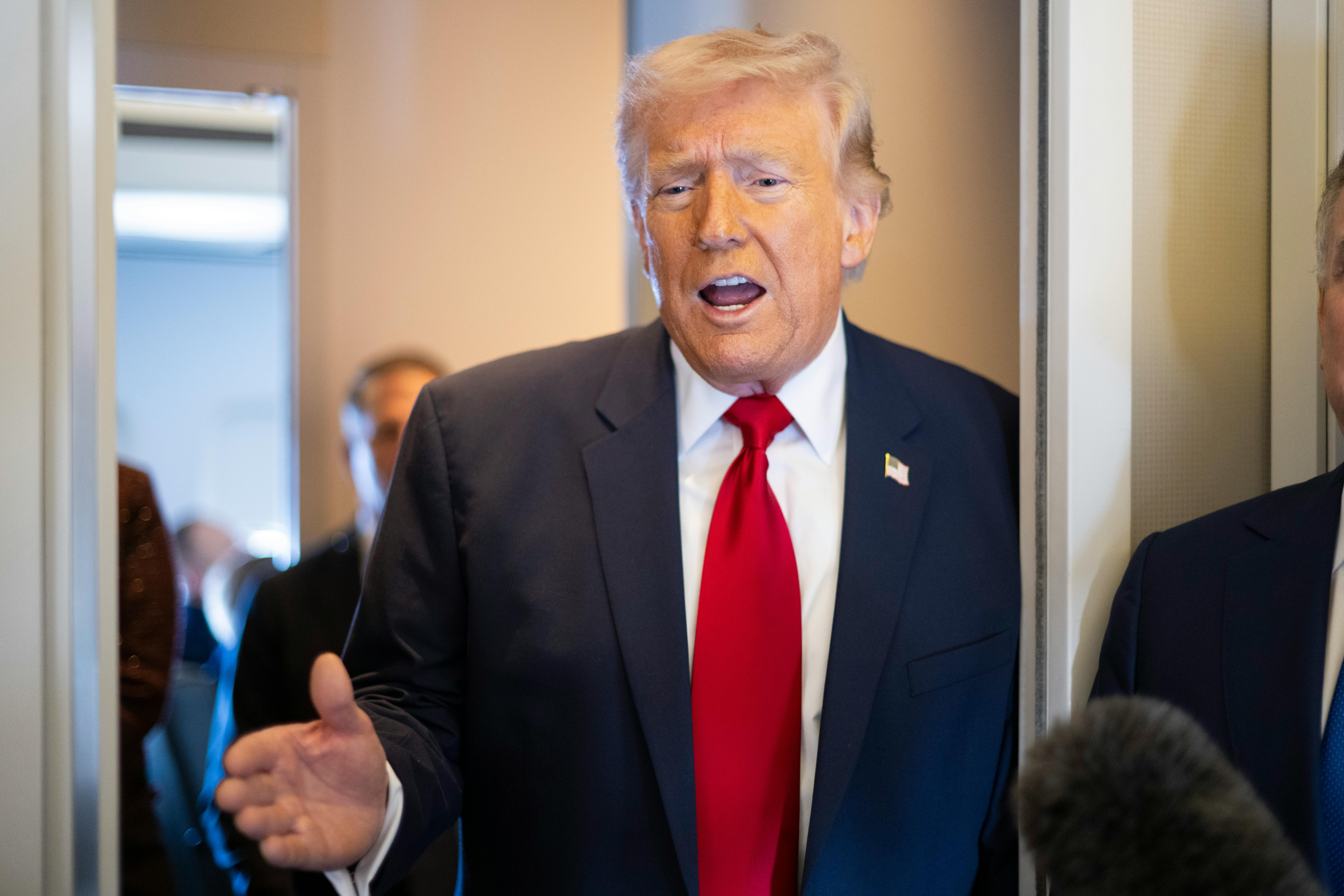Donald Trump speaking aboard Air Force One.