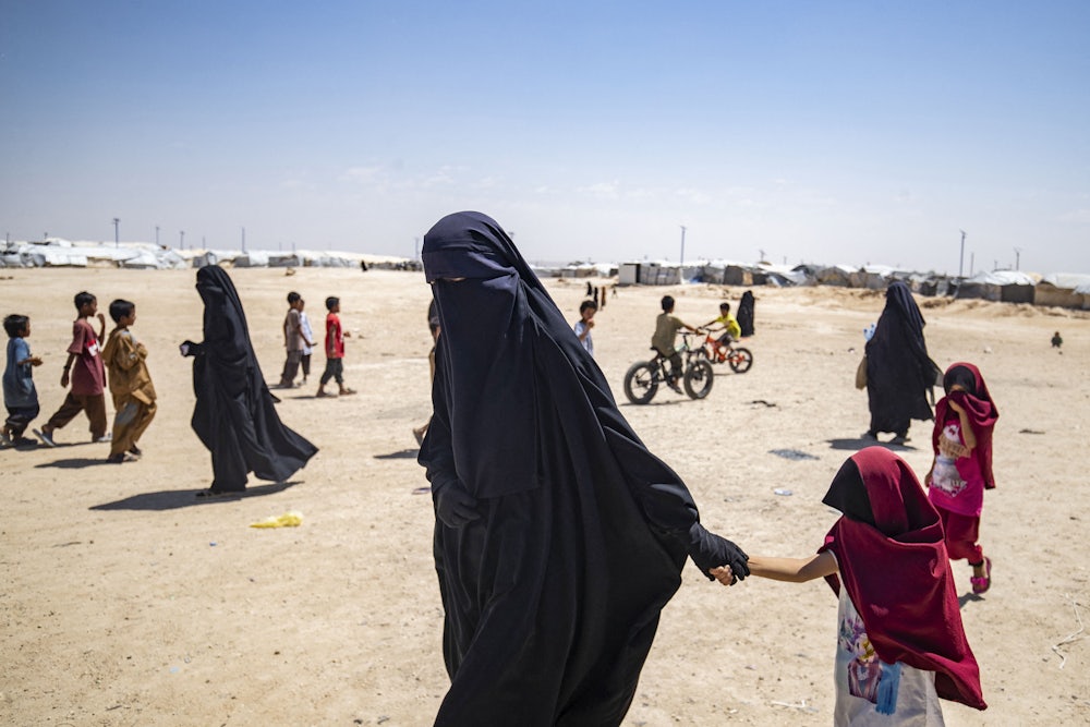 Women and children at the Al Hol refugee camp in Syria in 2023, where the Kurdish-led Syrian Democratic Forces hold spouses and children of fighters who volunteered to join ISIL