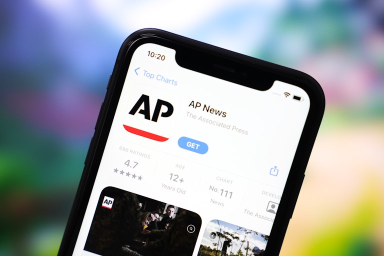A phone screen displays the App Store page for the AP News app
