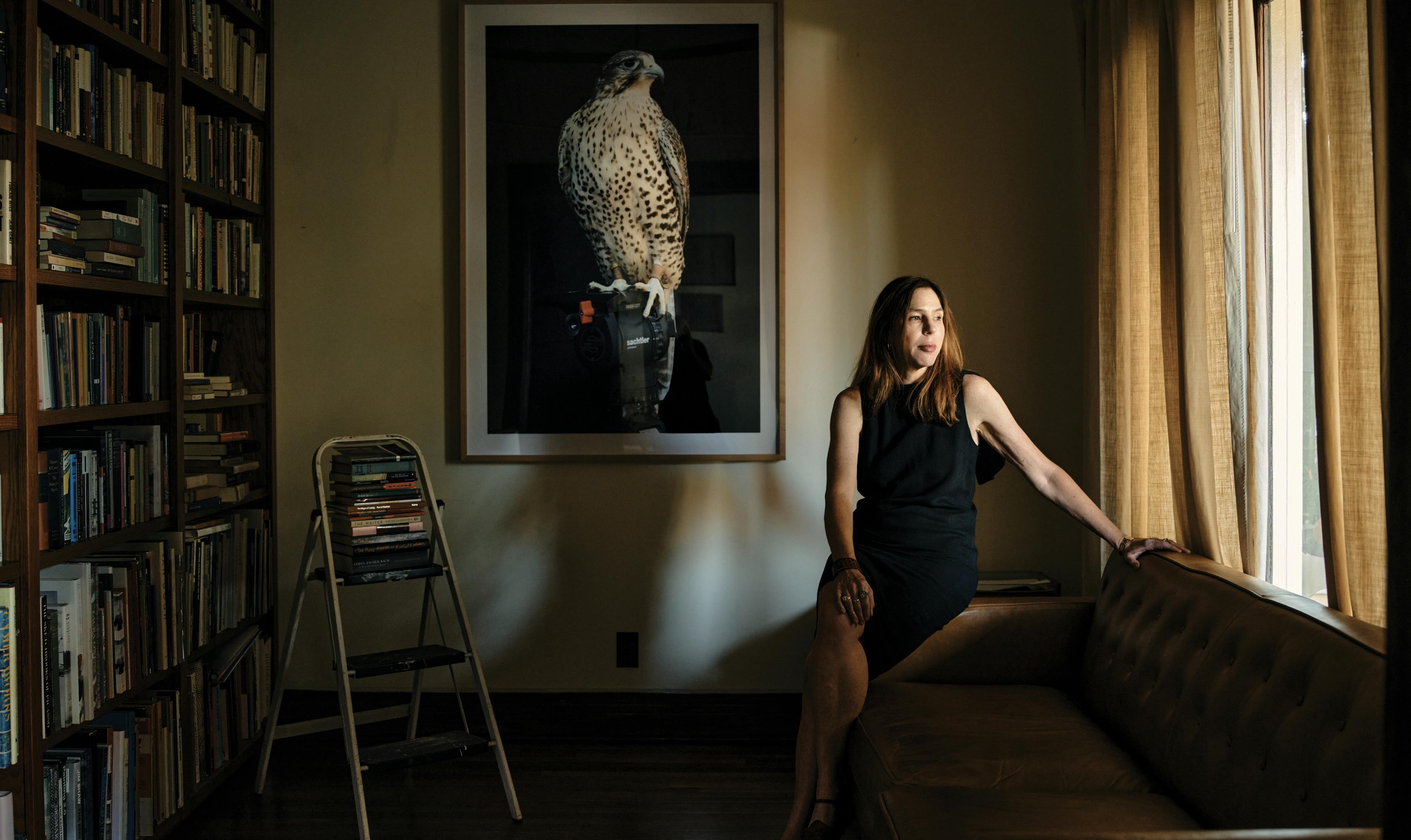 Author Rachel Kushner rests on her sofa at home. 