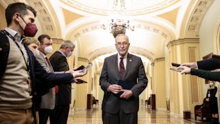  Senate Majority Leader Chuck Schumer speaks to reporters outside the Senate Chambers of the Capitol. 