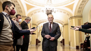 Senate Majority Leader Chuck Schumer speaks to reporters outside the Senate Chambers of the Capitol.