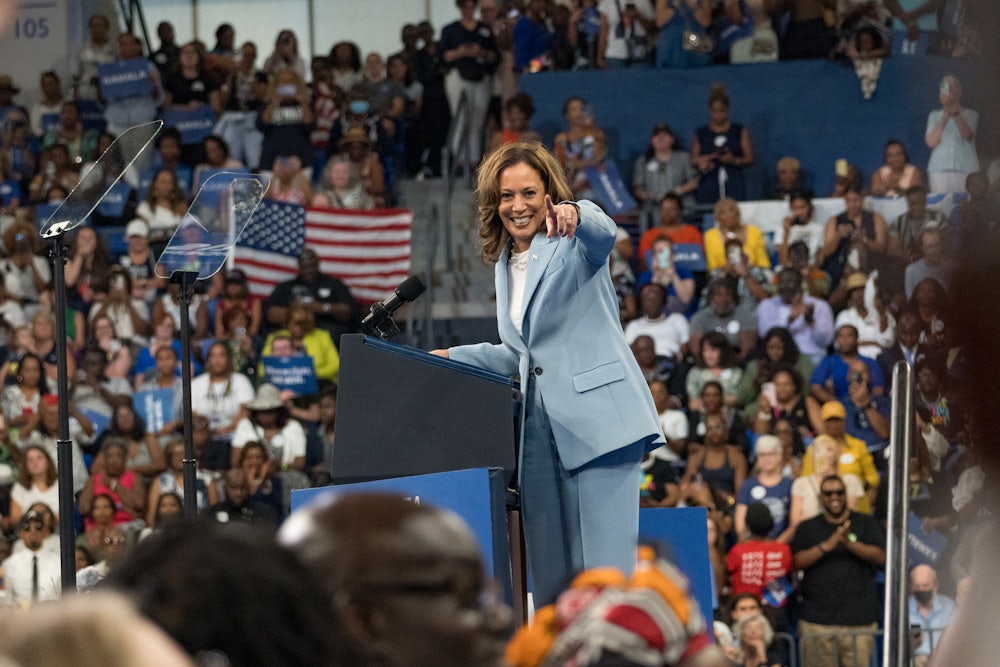 Kamala Harris points to the camera at a campaign rally in Atlanta.