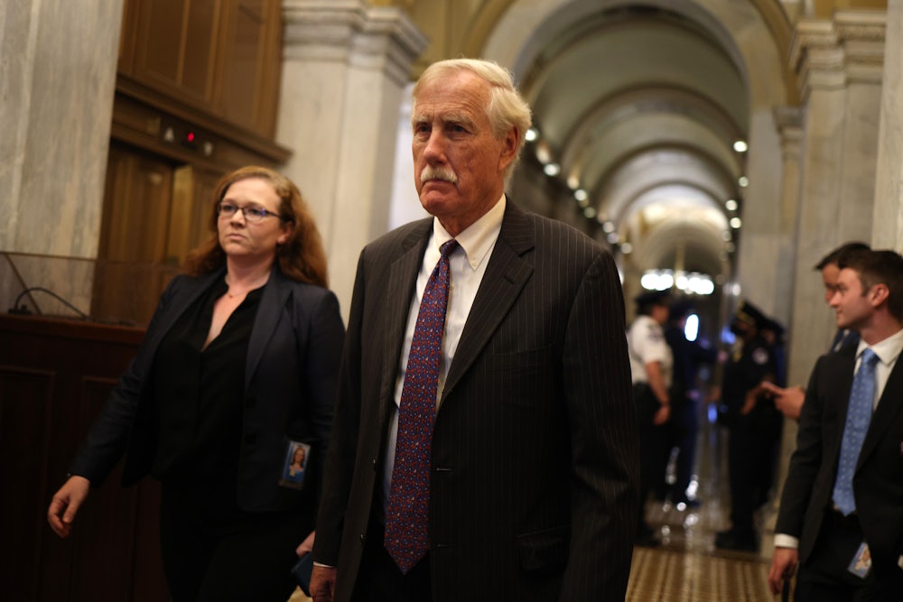 Maine Senator Angus King walks through Capitol Hill.