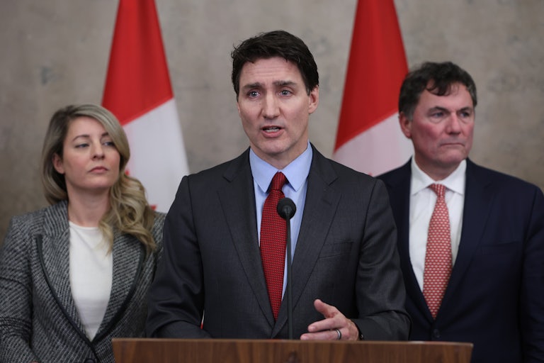 Canadian Prime Minister Justin Trudeau gives a press conference, flanked by Melanie Joly, Canada's foreign minister, and Dominic LeBlanc, Canada's finance and intergovernmental affairs minister.