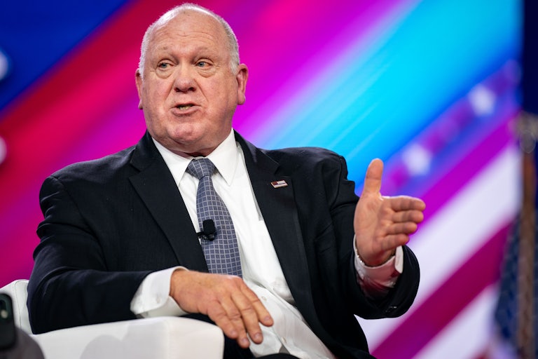 Tom Homan speaks and makes a hand gesture