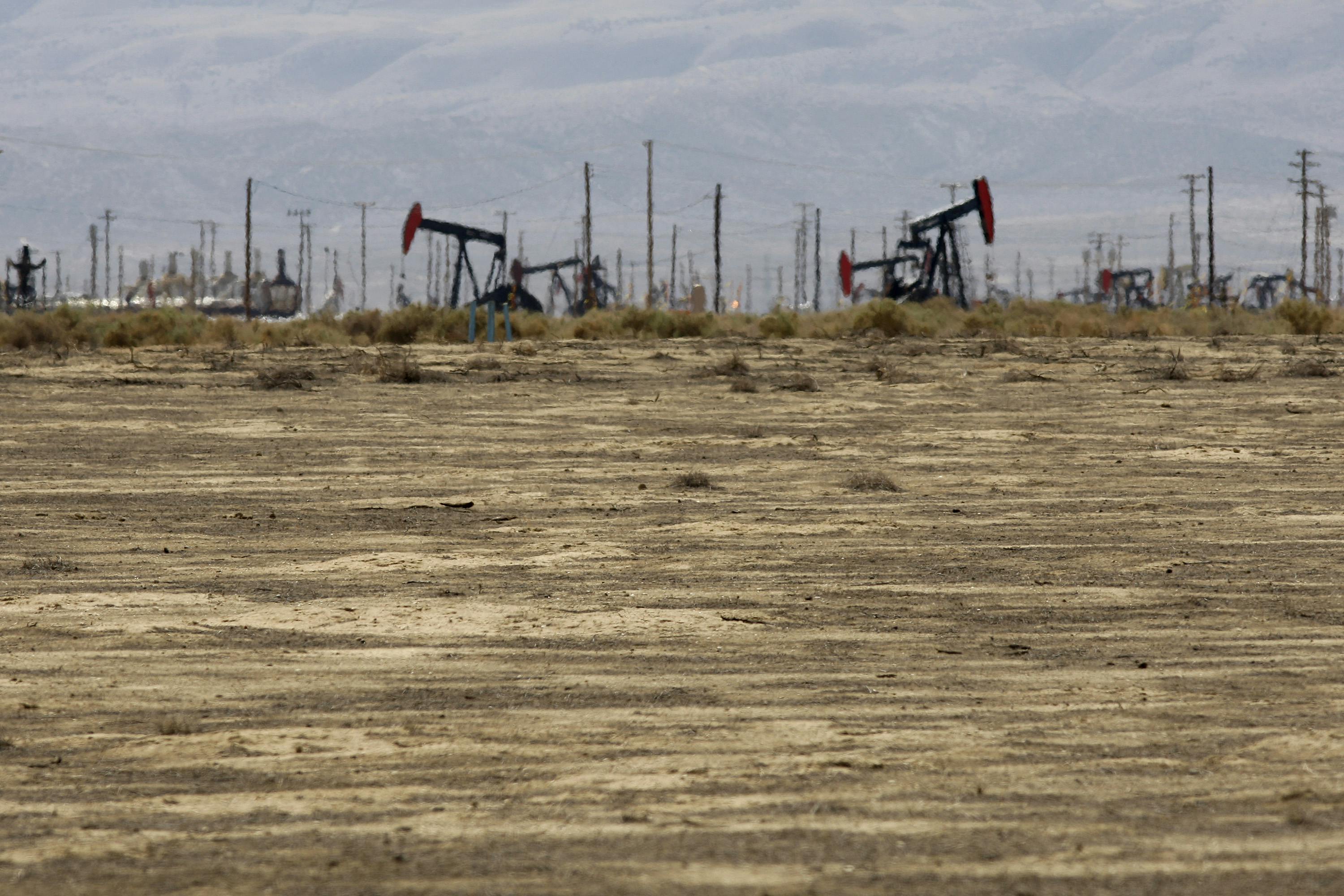 Drilling machinery stands in the California hills.