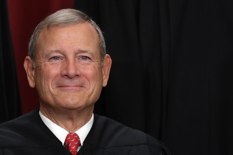 Supreme Court Chief Justice John Roberts smiles