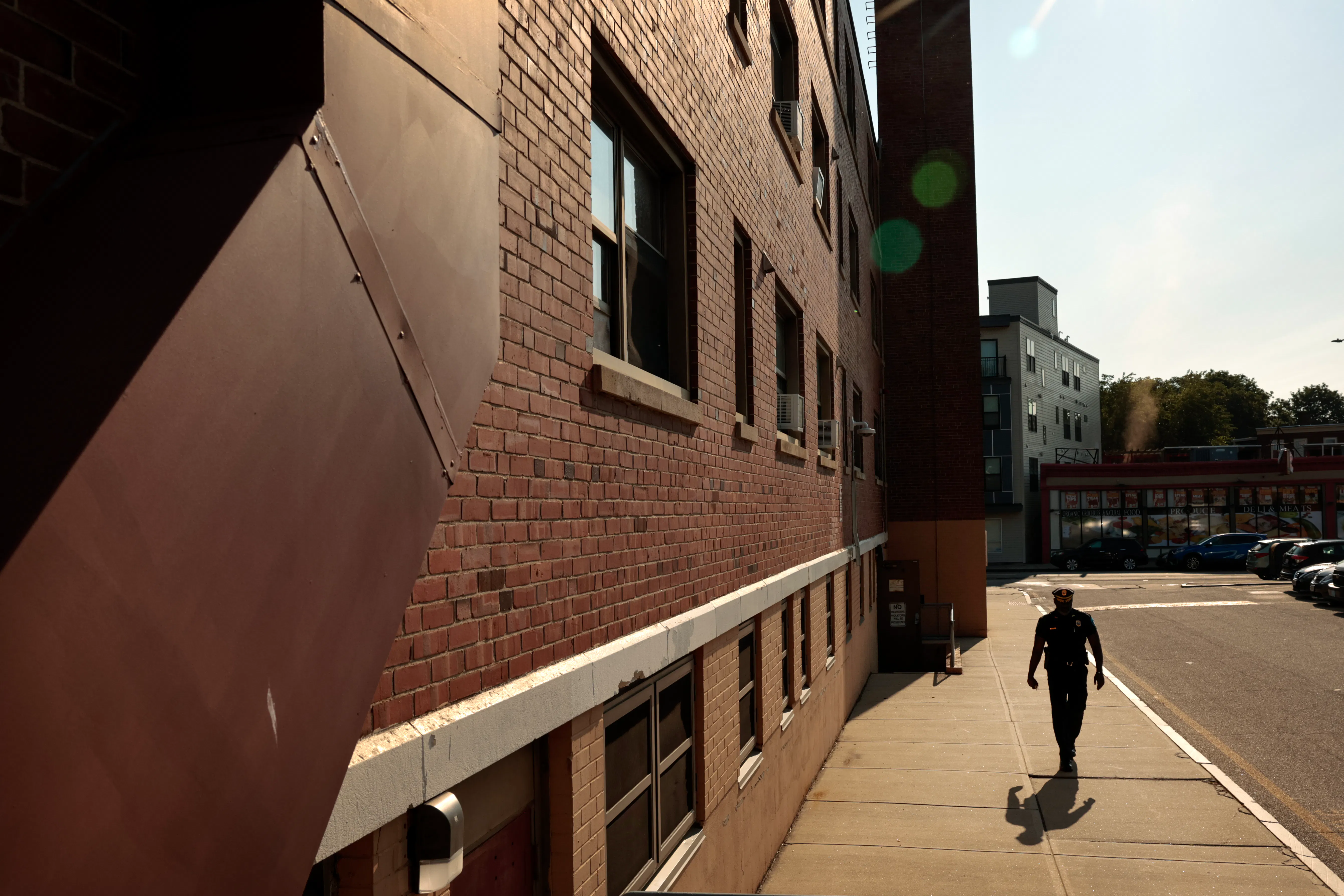 Boston Housing Authority Chief of Police and Public Safety Din Jenkins tours the South Street housing development in the Jamaica Plain neighborhood on June 11, 2025.