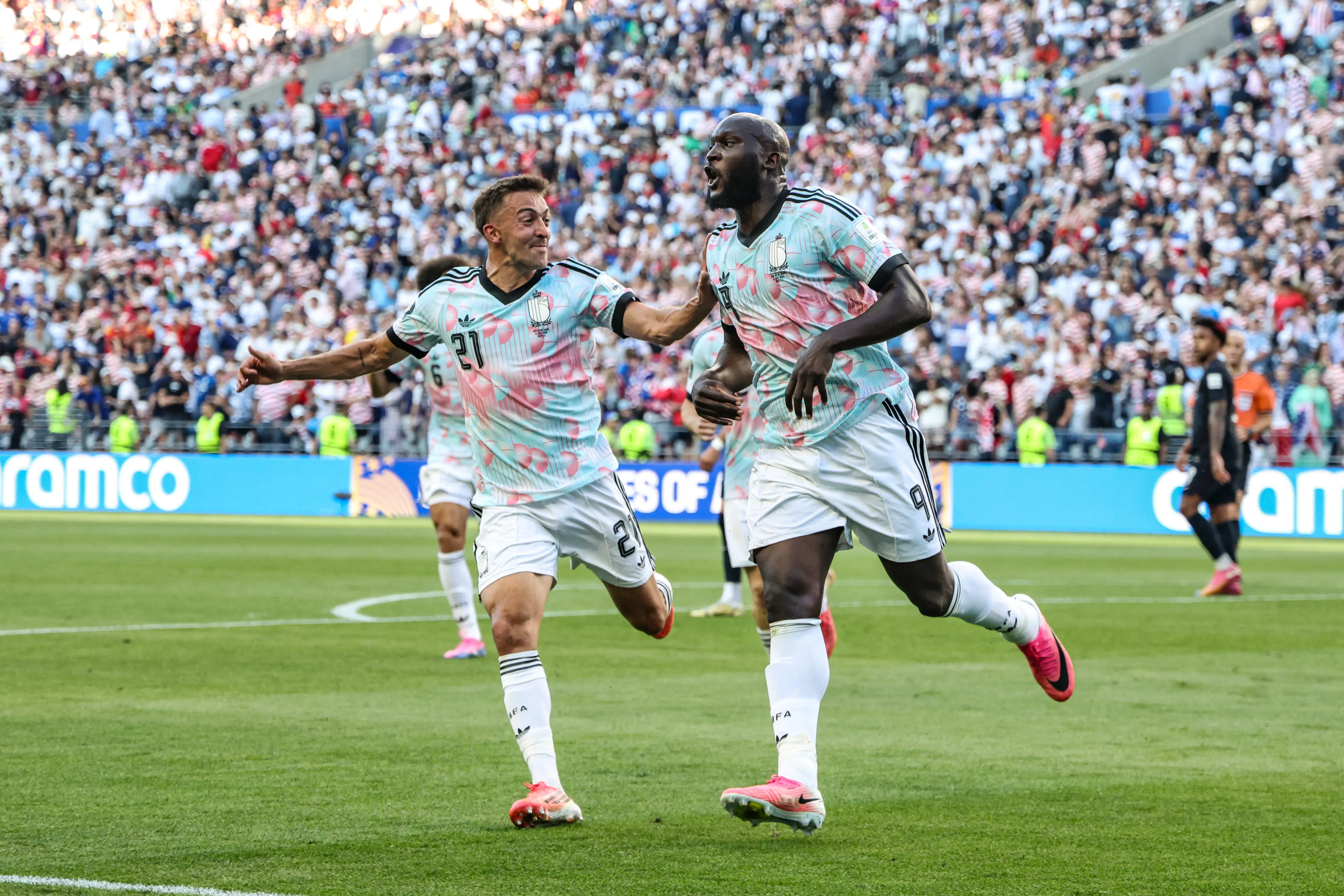 Belgian players celebrate after scoring a goal against the U.S. in the World Cup