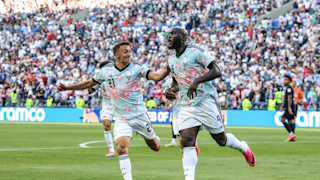 Belgian players celebrate after scoring a goal against the U.S. in the World Cup