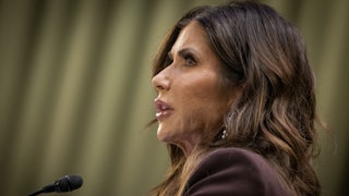 Kristi Noem speaks into a microphone during a Senate Judiciary Committee hearing