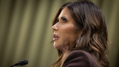 Kristi Noem speaks into a microphone during a Senate Judiciary Committee hearing