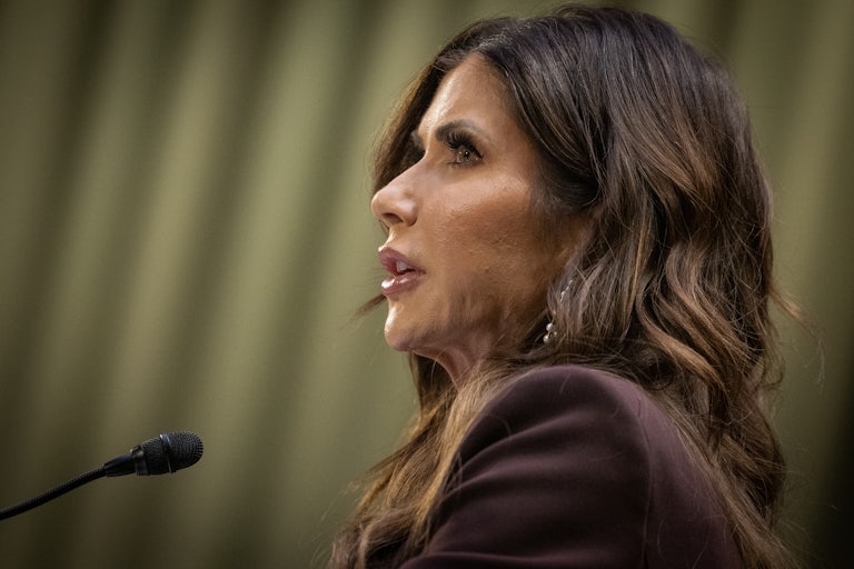Kristi Noem speaks into a microphone during a Senate Judiciary Committee hearing