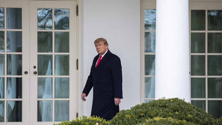 Donald Trump walks to the Oval Office.
