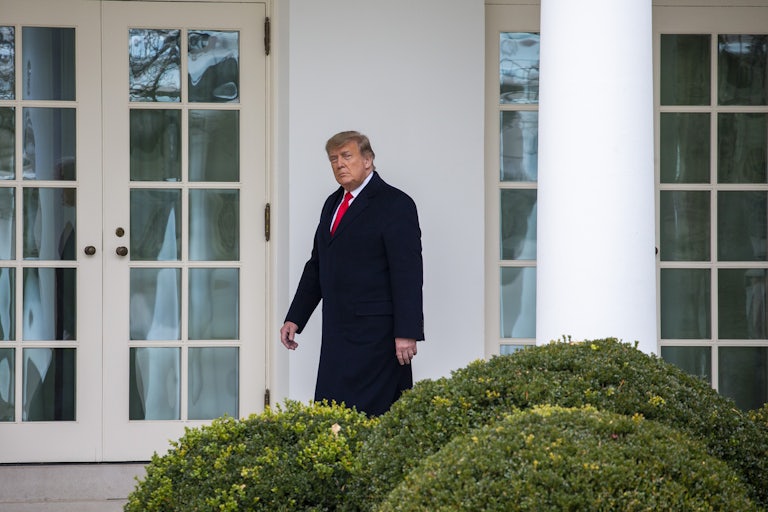 Donald Trump walks to the Oval Office.