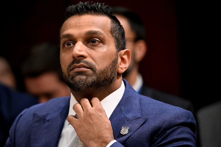 Kash Patel adjusts his tie