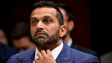 Kash Patel adjusts his tie