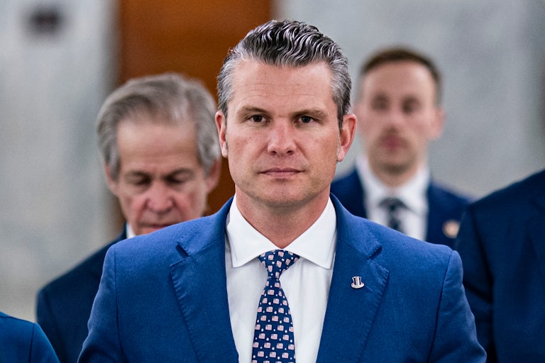 Pete Hegseth walks in the Capitol