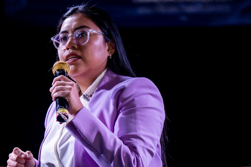 Jessica Cisneros holds a microphone while talking.