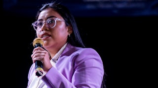 Jessica Cisneros holds a microphone while talking.