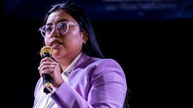 Jessica Cisneros holds a microphone while talking.