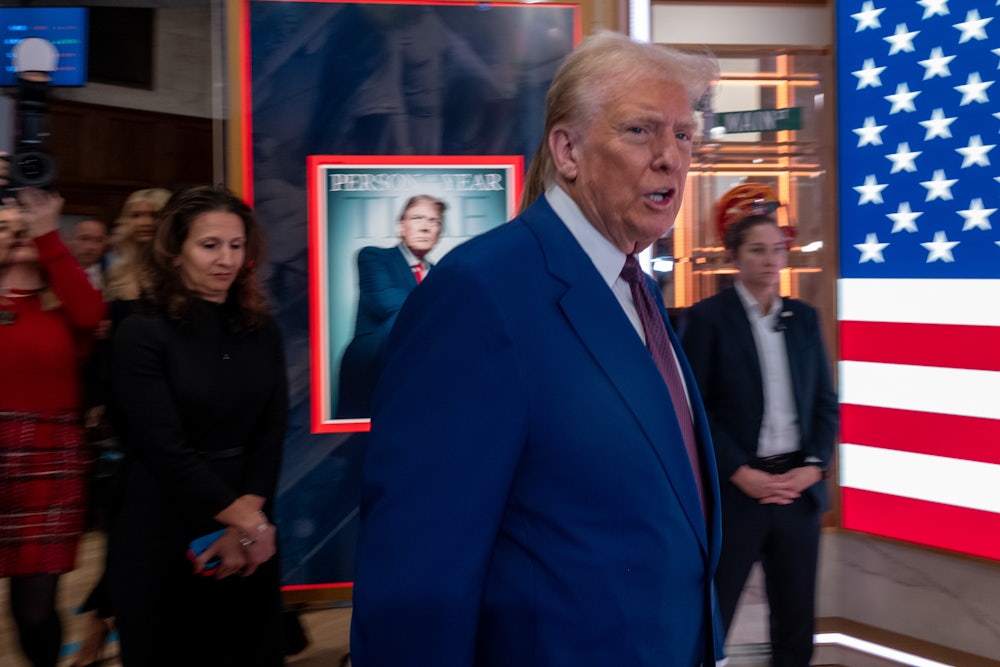 Donald Trump walks onto the floor of the New York Stock Exchange after being named TIME’s “Person of the Year.”