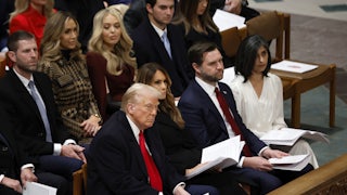 Donald Trump, Melania Trump, JD Vance, and Usha Vance seated in one pew at the inaugural prayer. Other Trump family members sit behind them.
