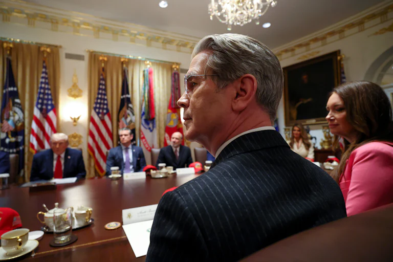 Treasury Secretary Scott Bessent looks to the side while sitting in Donald Trump's Cabinet meeting