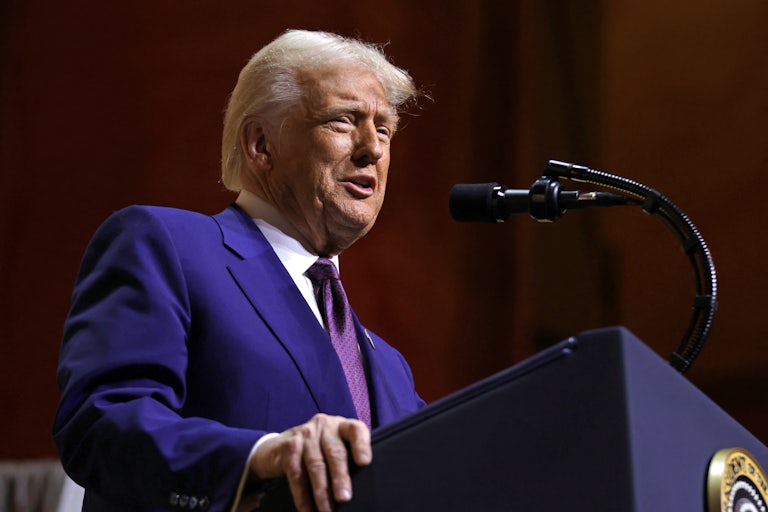 Donald Trump speaks at a podium during the Republican Governors' Association meeting