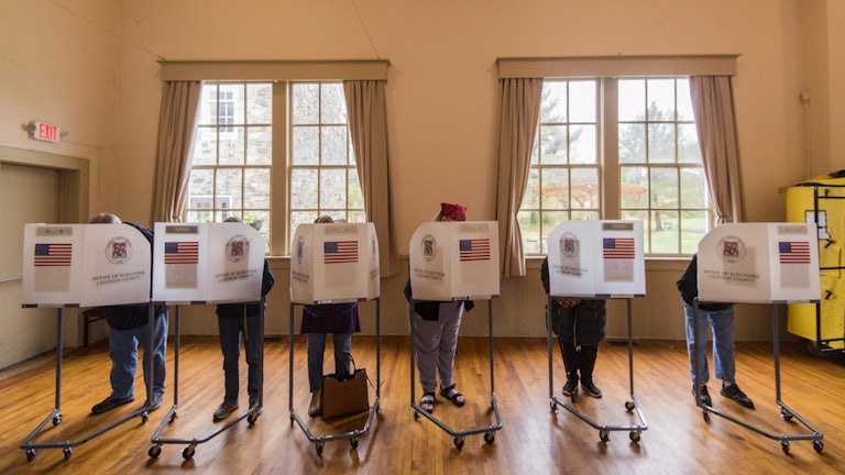 Voters fill out their ballots at the Old Stone School polling location in Hillsboro, Virginia.