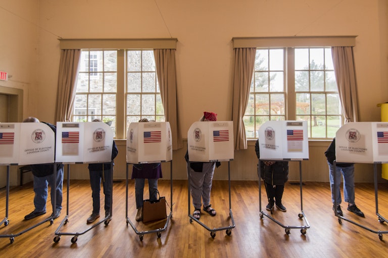 Voters fill out their ballots at the Old Stone School polling location in Hillsboro, Virginia.